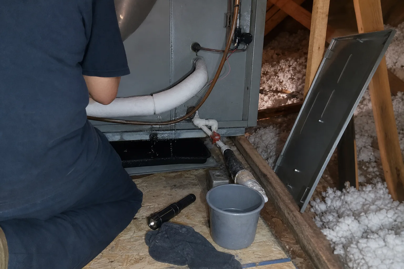 Frost on a refrigerant line at an air handler with water dripping into a drain pan - for Frozen AC Coil / AC Leaking Water in Alhambra, CA